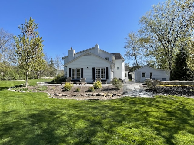 1414 N Ave, Bannockburn, IL 60015 - rear view of property with a yard, a patio area, and a chimney