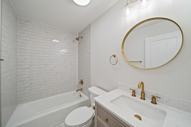 bathroom featuring toilet, bathing tub / shower combination, and vanity