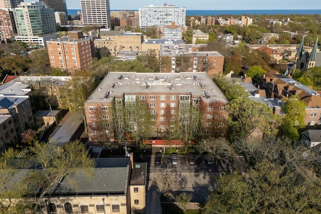 aerial view of property and surrounding area featuring nearby urban area