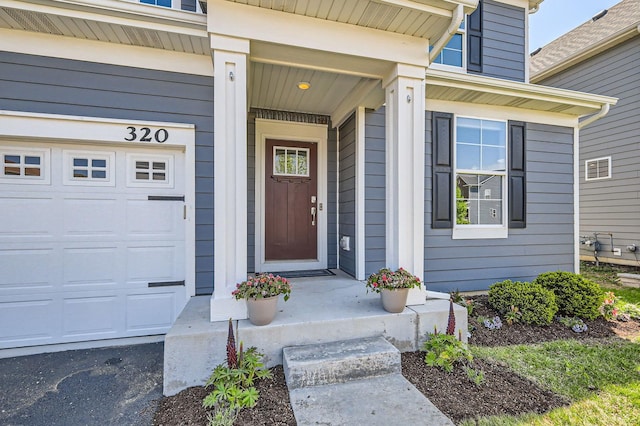 property entrance featuring a garage