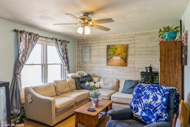 4 E Streamwood Blvd, Streamwood, IL 60107 - living area featuring wood walls, a ceiling fan, and an accent wall