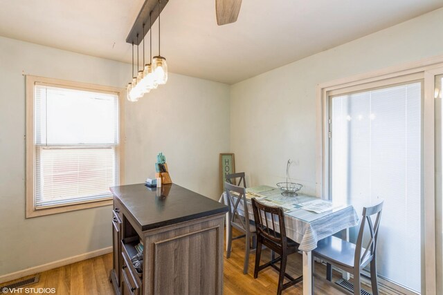 4 E Streamwood Blvd, Streamwood, IL 60107 - dining space with light wood finished floors, baseboards, and a ceiling fan