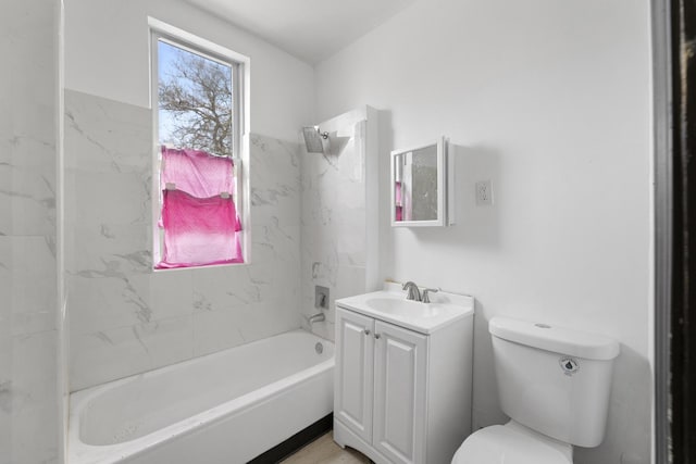 bathroom featuring vanity, toilet, and shower / washtub combination