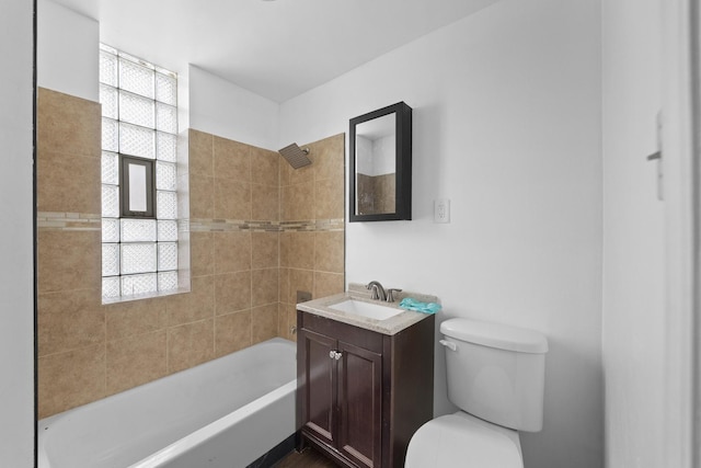 full bath with toilet, healthy amount of natural light, vanity, and tub / shower combination