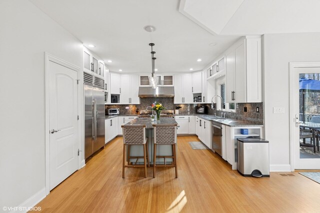20662 Francisca Way, Frankfort, IL 60423 - kitchen with appliances with stainless steel finishes, light wood-type flooring, a sink, backsplash, and recessed lighting