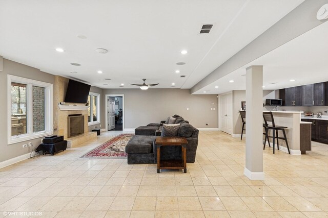 20662 Francisca Way, Frankfort, IL 60423 - living area with recessed lighting, baseboards, a tile fireplace, light tile patterned floors, and ceiling fan