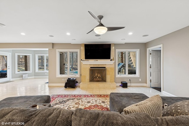 20662 Francisca Way, Frankfort, IL 60423 - tiled living area featuring baseboards, ceiling fan, healthy amount of natural light, a tiled fireplace, and recessed lighting
