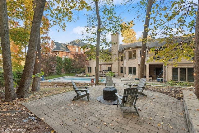 20662 Francisca Way, Frankfort, IL 60423 - view of patio / terrace featuring an outdoor pool, a fire pit, and a balcony