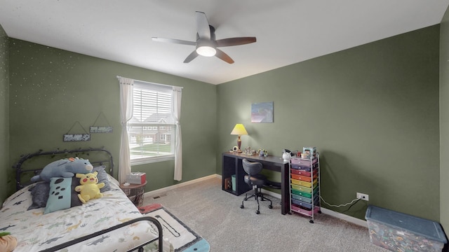 bedroom with carpet floors, baseboards, ceiling fan, and an office area
