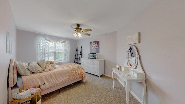 bedroom with light carpet, ceiling fan, and baseboards