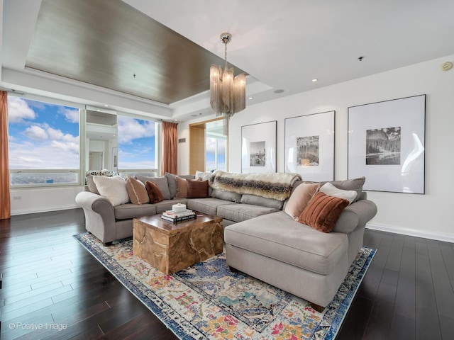 33 W Ontario St Unit 58E, Chicago, IL 60654 - living area featuring dark wood-style floors, a raised ceiling, baseboards, and a chandelier