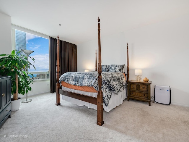 33 W Ontario St Unit 58E, Chicago, IL 60654 - bedroom with light carpet and baseboards
