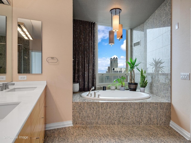 33 W Ontario St Unit 58E, Chicago, IL 60654 - bathroom with baseboards, a bath, and double vanity