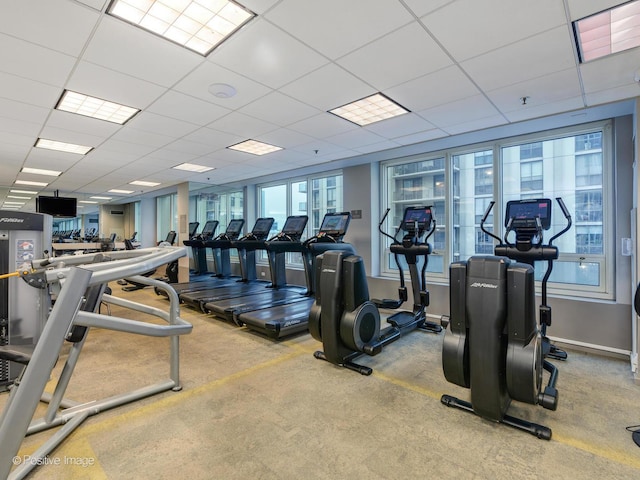 33 W Ontario St Unit 58E, Chicago, IL 60654 - workout area featuring a paneled ceiling and baseboards