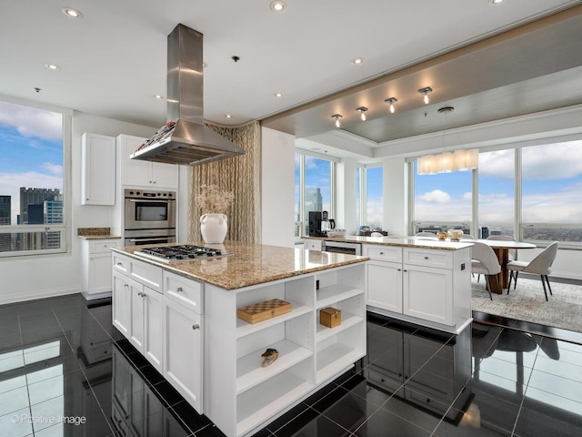 33 W Ontario St Unit 58E, Chicago, IL 60654 - kitchen with island exhaust hood, a kitchen island, open shelves, white cabinetry, and recessed lighting