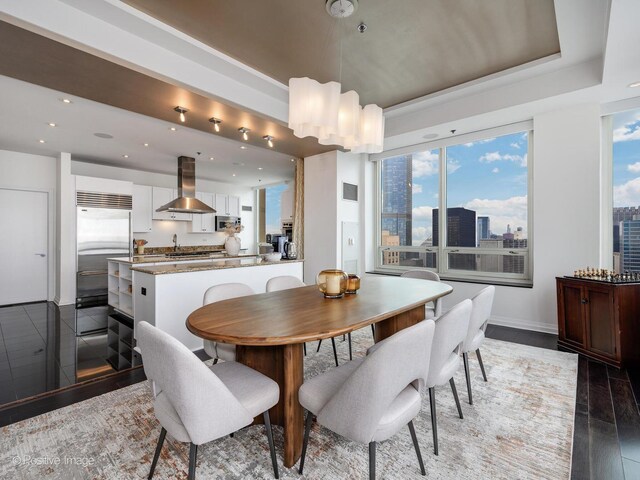 33 W Ontario St Unit 58E, Chicago, IL 60654 - dining space featuring plenty of natural light, baseboards, a tray ceiling, recessed lighting, and a view of city
