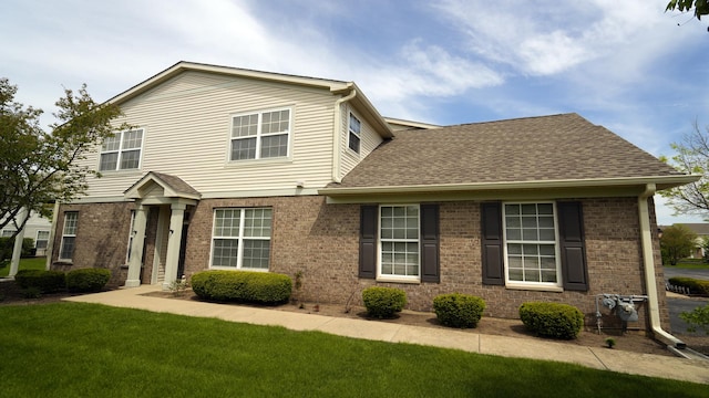 2620 Christie Dr, Algonquin, IL 60102 - view of front facade with brick siding, a front lawn, and a shingled roof