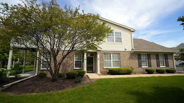 2620 Christie Dr, Algonquin, IL 60102 - view of property hidden behind natural elements with a front lawn and brick siding