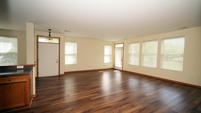 2620 Christie Dr, Algonquin, IL 60102 - unfurnished living room with healthy amount of natural light, dark wood-style floors, and baseboards