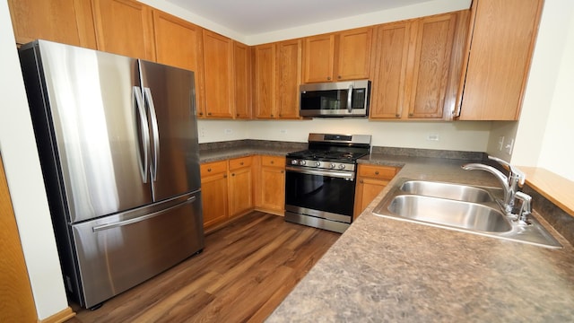 2620 Christie Dr, Algonquin, IL 60102 - kitchen with stainless steel appliances, a sink, dark wood-style flooring, and brown cabinets