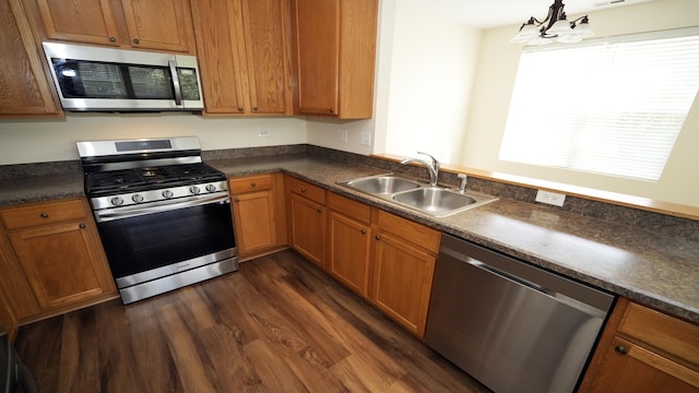2620 Christie Dr, Algonquin, IL 60102 - kitchen featuring stainless steel appliances, a sink, and dark countertops