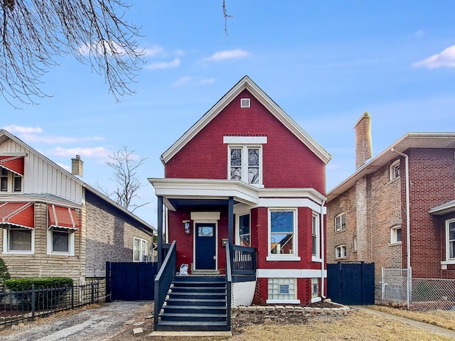 7317 S Maryland Ave, Chicago, IL 60619 - view of front of property featuring brick siding, fence, and a porch
