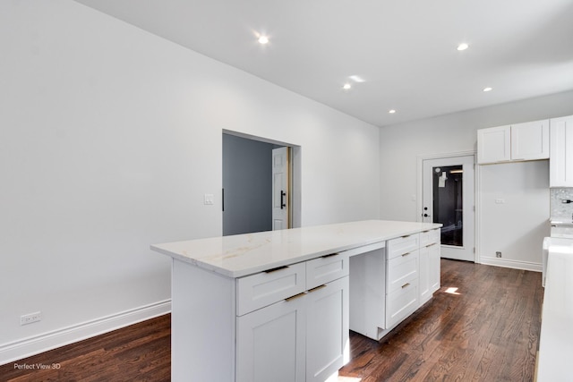 7317 S Maryland Ave, Chicago, IL 60619 - kitchen with dark wood-style flooring, a kitchen island, white cabinetry, and recessed lighting