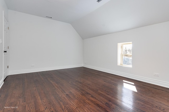 7317 S Maryland Ave, Chicago, IL 60619 - bonus room with lofted ceiling, dark wood-type flooring, and baseboards