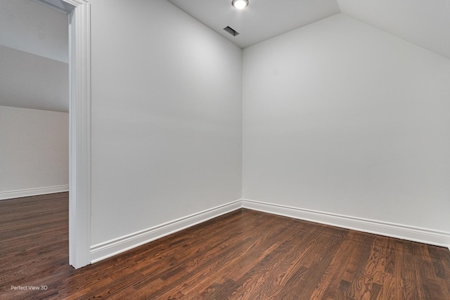7317 S Maryland Ave, Chicago, IL 60619 - unfurnished room with vaulted ceiling, dark wood-style flooring, and baseboards