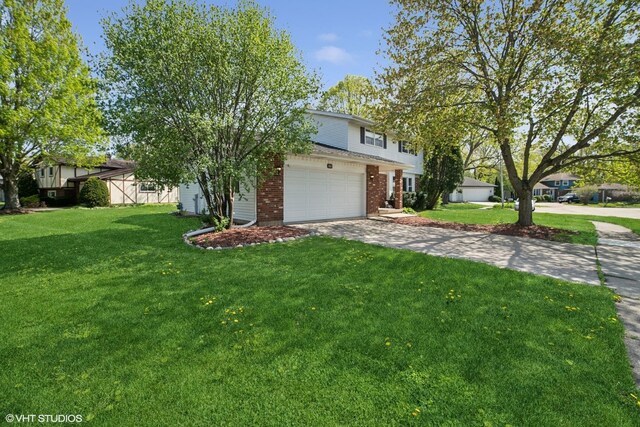 86 Brookside Dr, Elgin, IL 60123 - view of front of house with brick siding, driveway, a front yard, and an attached garage