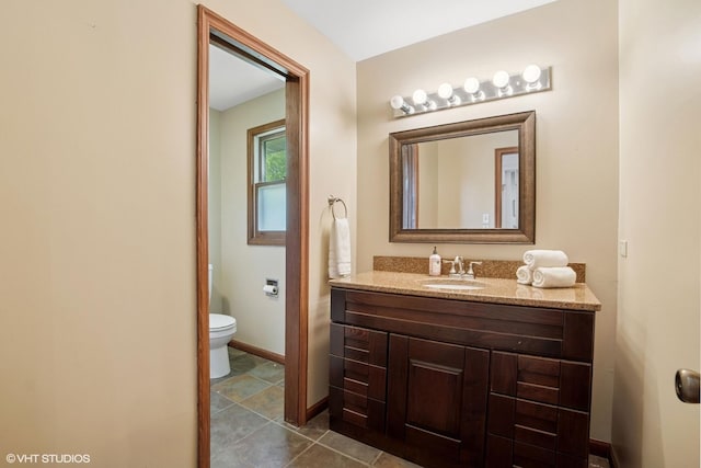 86 Brookside Dr, Elgin, IL 60123 - bathroom featuring vanity, toilet, and baseboards