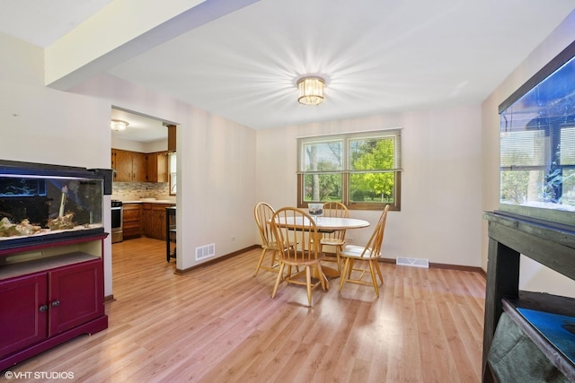 86 Brookside Dr, Elgin, IL 60123 - dining space featuring light wood-style flooring and baseboards