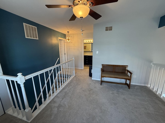 8223 170th St, Tinley Park, IL 60477 - living area featuring an upstairs landing, light colored carpet, a ceiling fan, and baseboards