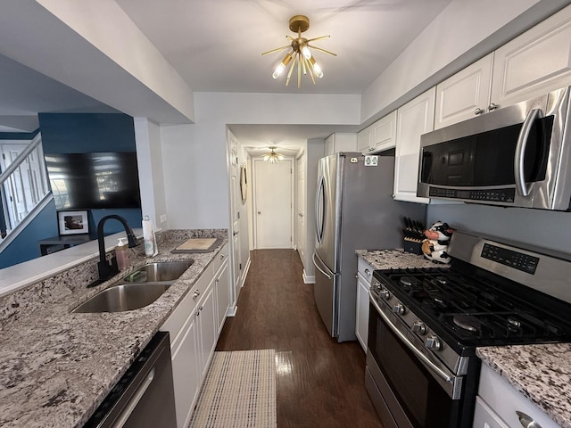 8223 170th St, Tinley Park, IL 60477 - kitchen with stainless steel appliances, a sink, light stone counters, white cabinets, and dark wood-type flooring