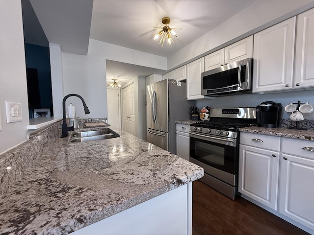 8223 170th St, Tinley Park, IL 60477 - kitchen featuring stainless steel appliances, a sink, white cabinets, and light stone countertops