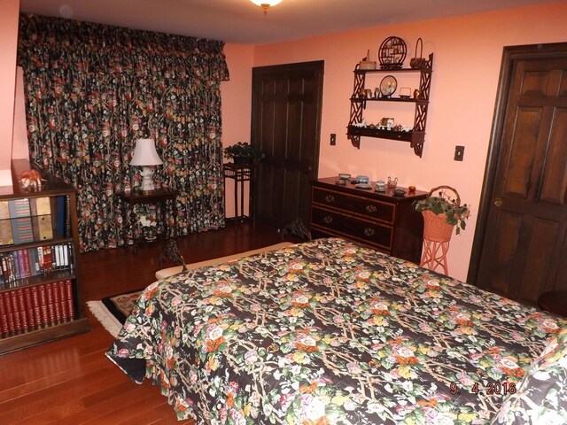 bedroom featuring wood finished floors