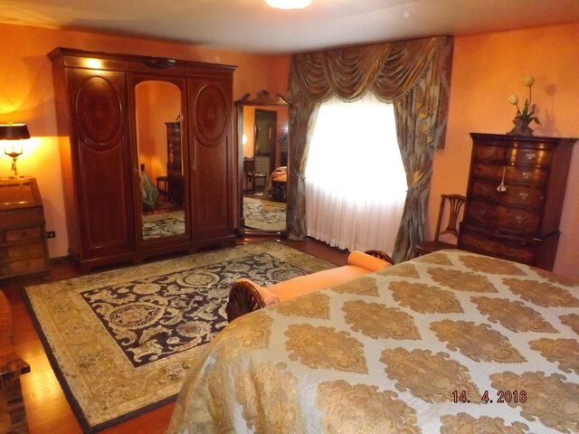 bedroom with wood finished floors