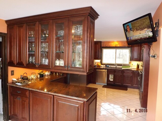 indoor bar with dishwasher and light tile patterned floors