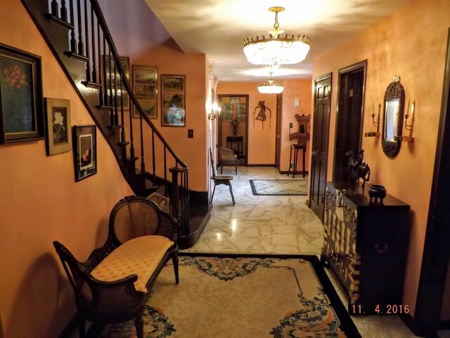 foyer with a chandelier and stairs