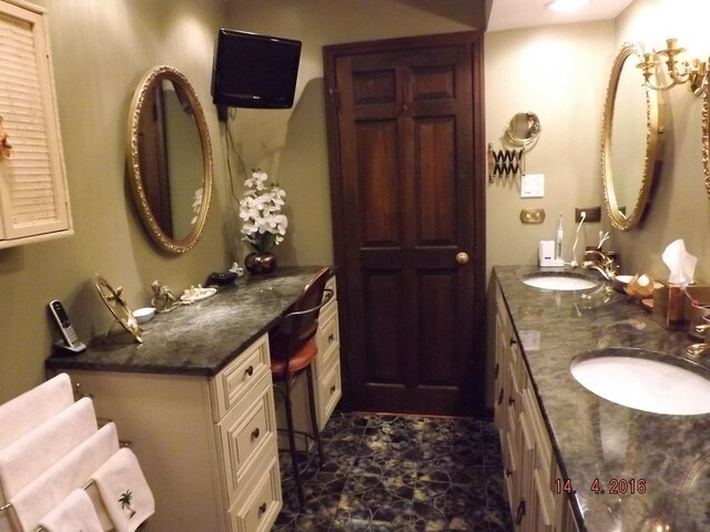 bathroom featuring double vanity