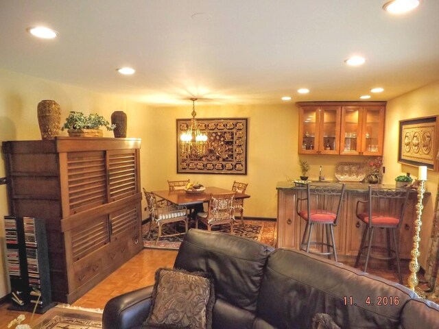 3550 Whirlaway Dr, Northbrook, IL 60062 - living room with recessed lighting, bar, and a chandelier
