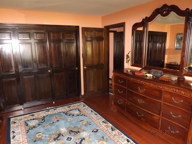 bedroom with wood finished floors