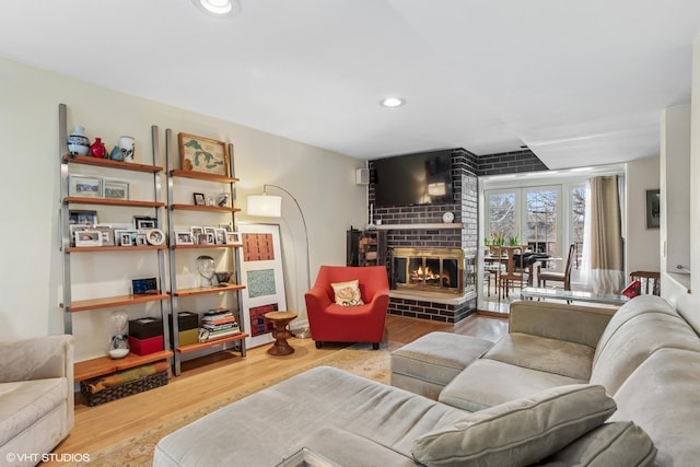 1747 N Fern Ct, Chicago, IL 60614 - living room with wood finished floors, a brick fireplace, and recessed lighting