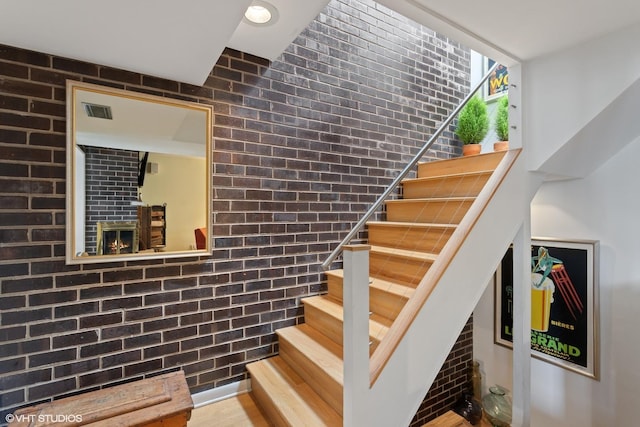 1747 N Fern Ct, Chicago, IL 60614 - staircase featuring brick wall