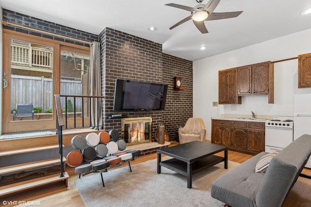 1747 N Fern Ct, Chicago, IL 60614 - living room with a ceiling fan, light wood-style flooring, recessed lighting, and a fireplace