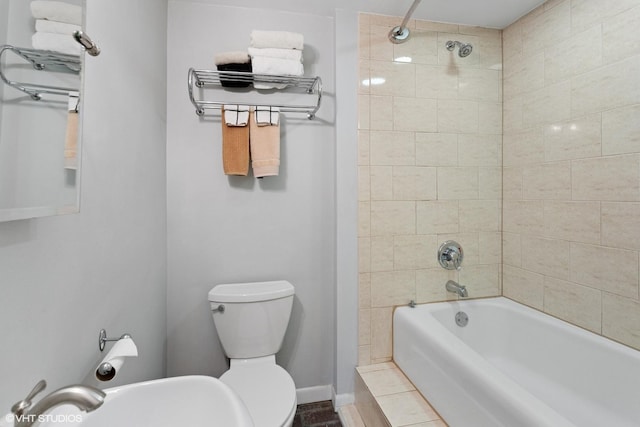 1747 N Fern Ct, Chicago, IL 60614 - bathroom featuring bathing tub / shower combination, a sink, and toilet