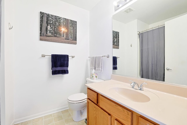 17 Ronan Ct, Lake In The Hills, IL 60156 - bathroom with vanity, toilet, baseboards, and a shower with curtain