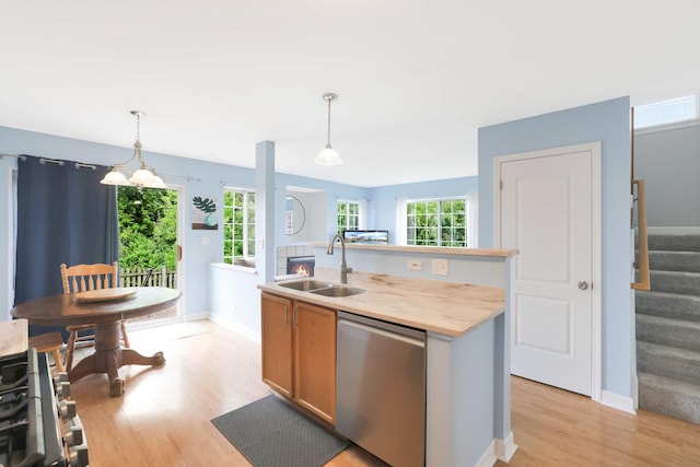17 Ronan Ct, Lake In The Hills, IL 60156 - kitchen with dishwasher, a sink, light wood-style flooring, and healthy amount of natural light
