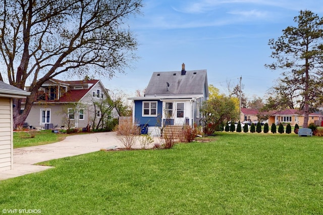 666 Greenview Ave, Des Plaines, IL 60016 - back of house with concrete driveway, a yard, a chimney, and central AC unit