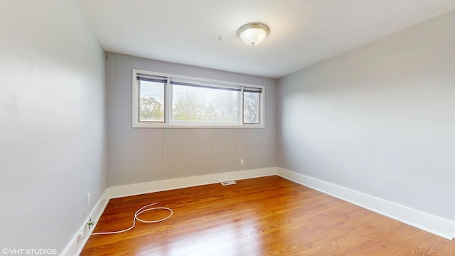 666 Greenview Ave, Des Plaines, IL 60016 - spare room with baseboards and wood finished floors